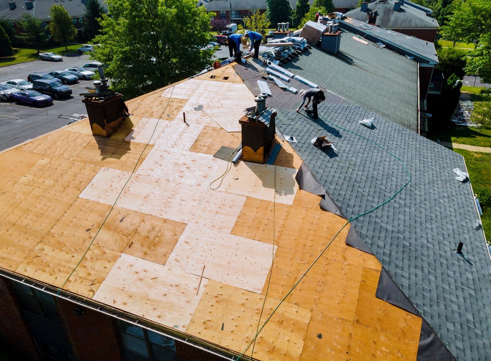 Reroof in progress showing new underlayment and old shingles
